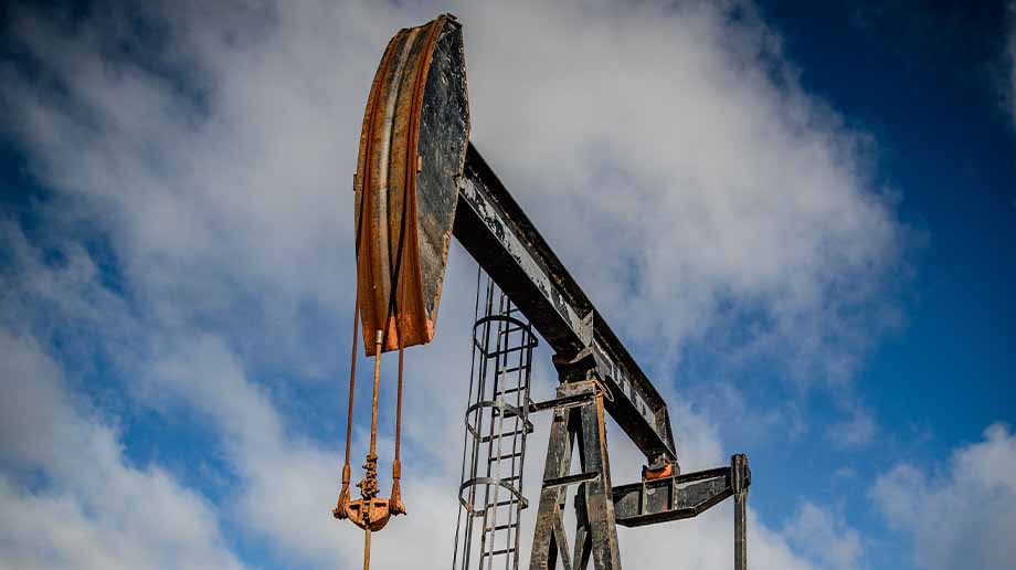 Rusty oil pump on a cloudy day