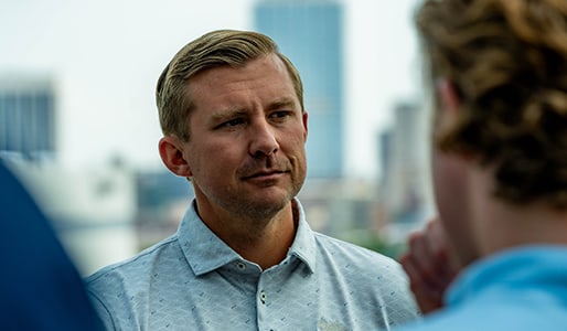 man listening intently in conversation