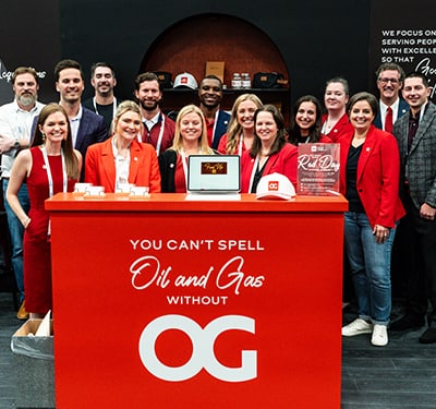 Oliva Gibbs group photo in front of branded podium