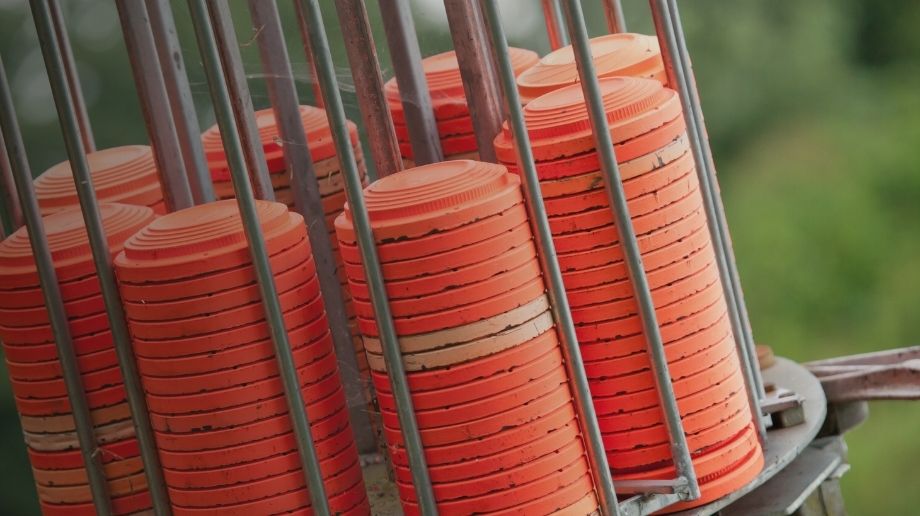 Close up of stacks of orange clay pigeons