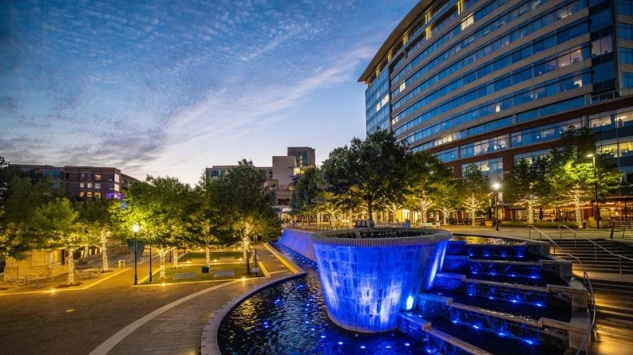 Waterway Square in The Woodlands, TX illuminated at dusk