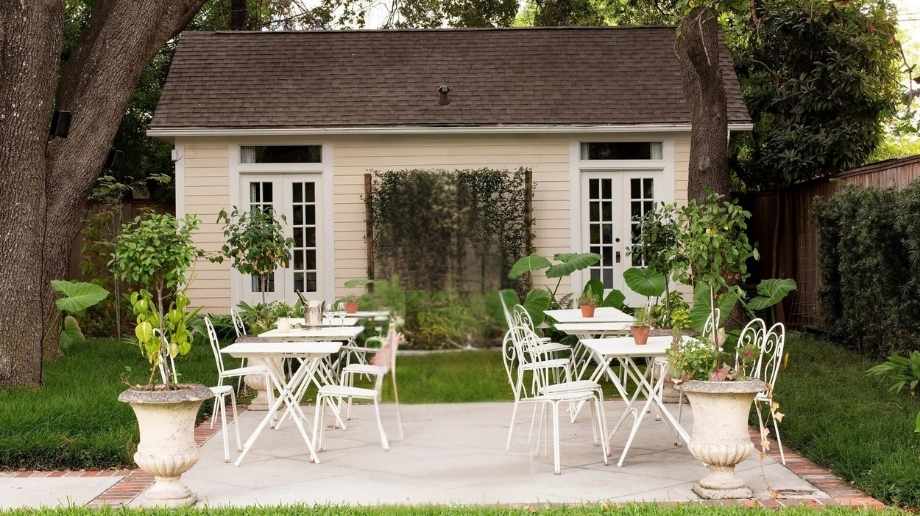 Daytime exterior view of garden at Bar Madonna in Houston