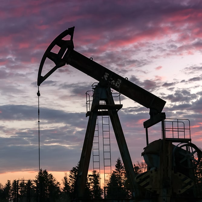 Oil pump silhouette against night sky
