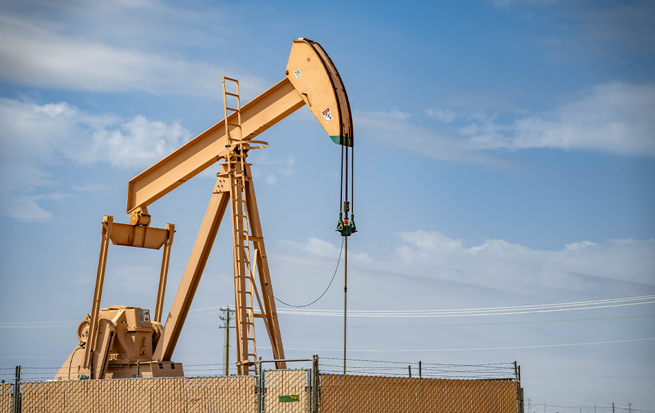 Fenced-in yellow oil pump