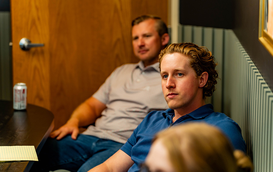 Men in a conference room viewing a presentation