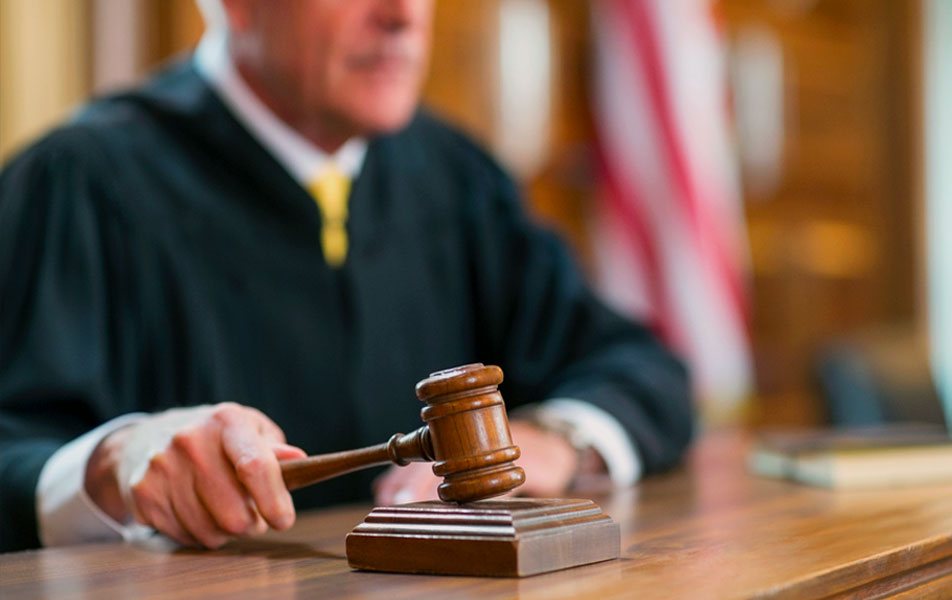 Judge banging gavel in court